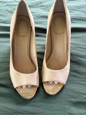 Dior leather pumps with gold cannage metal detailing on the peep toe and heel.